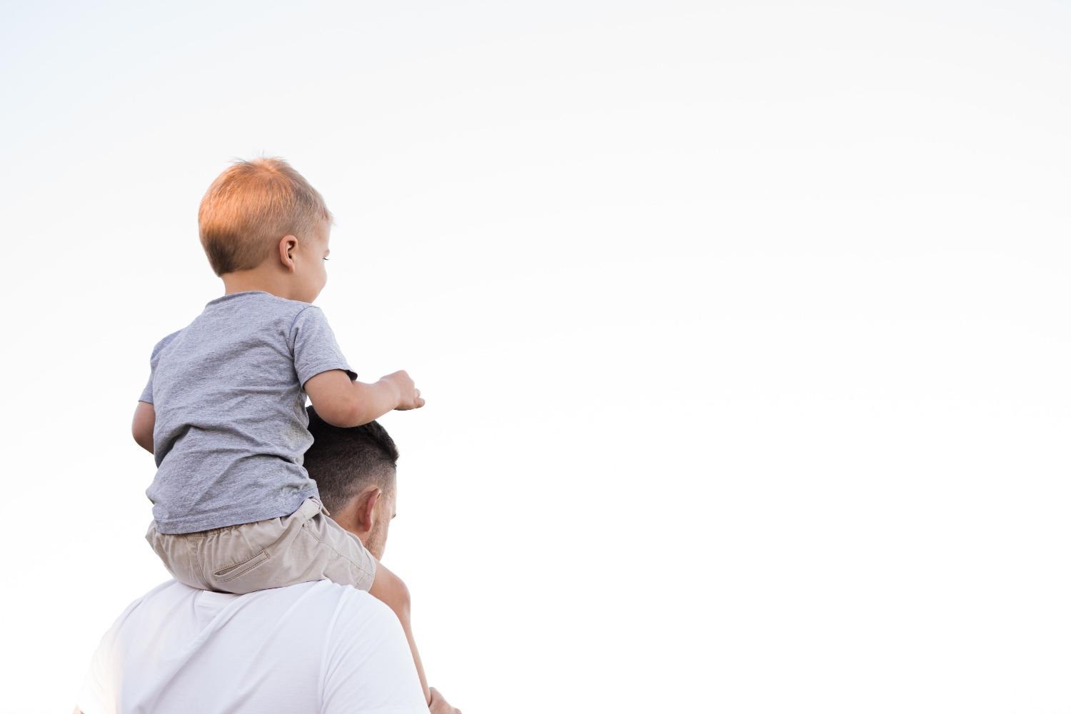 Man with child on his shoulders