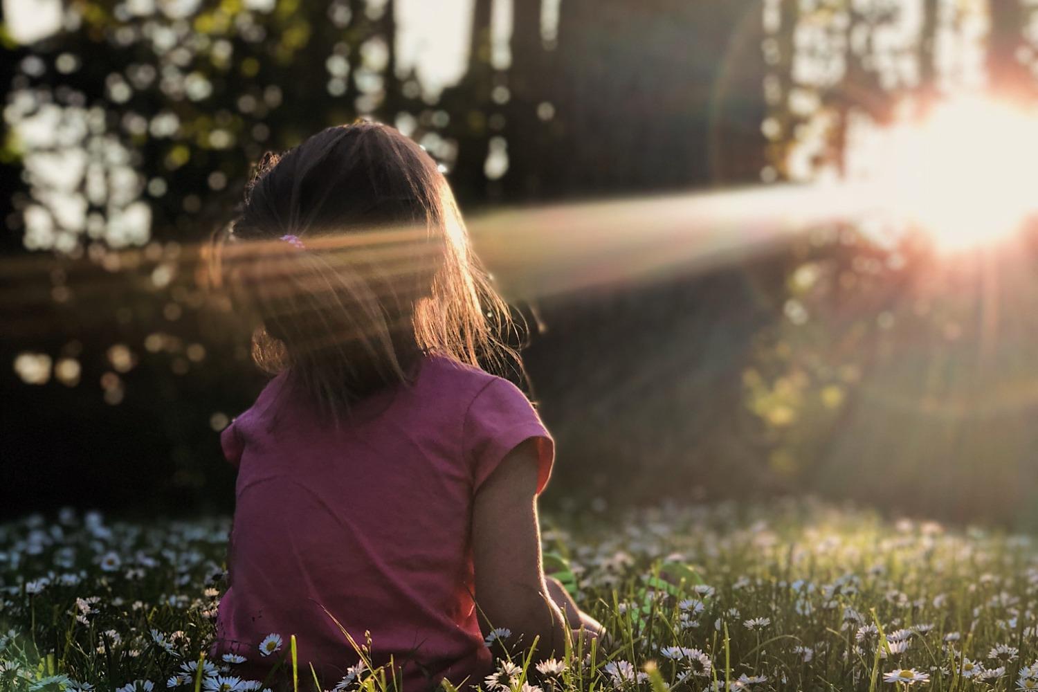 A child sits in the sun