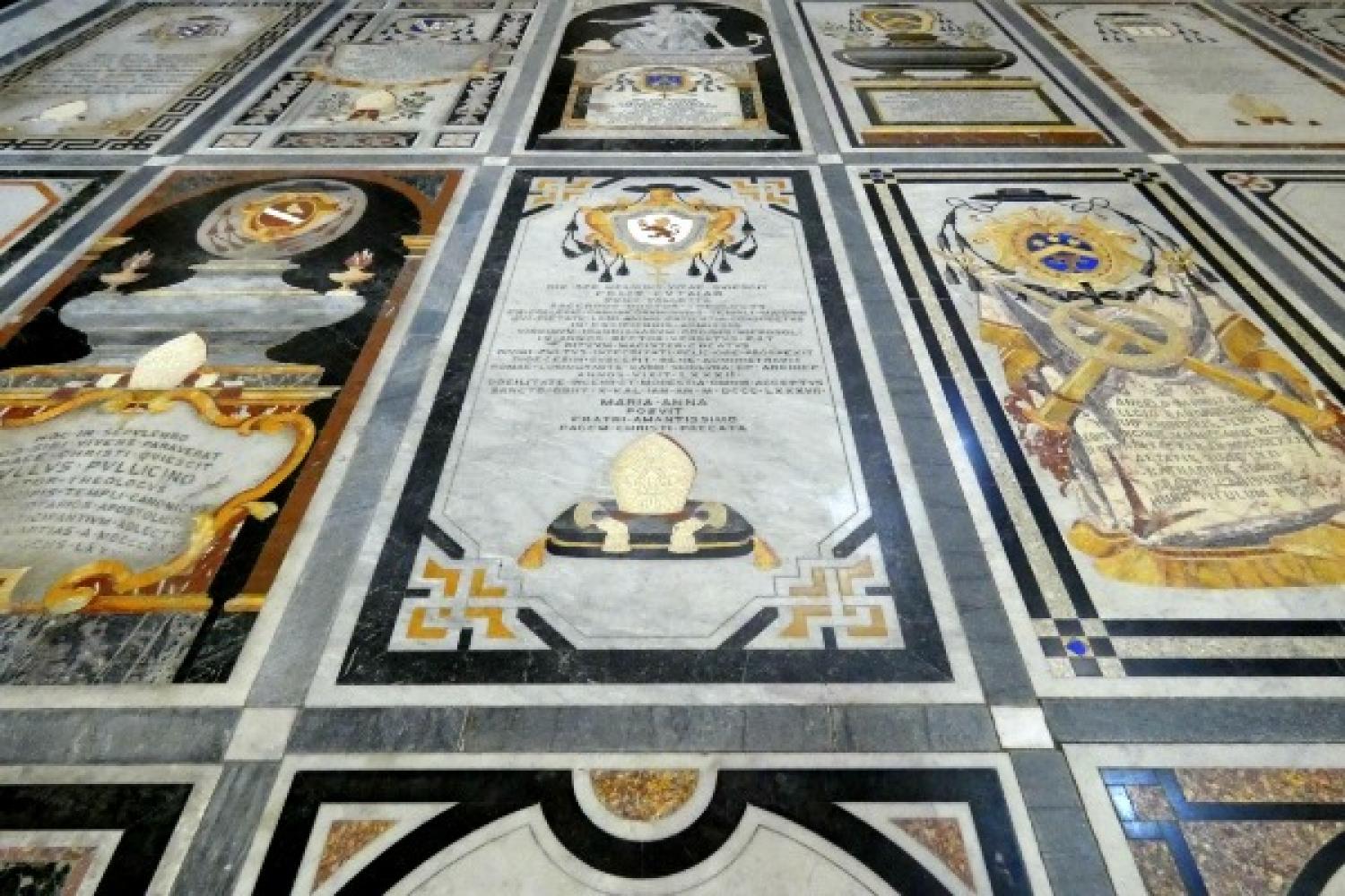 Marble tombstones and monuments in the floor of the Mdina Cathedral