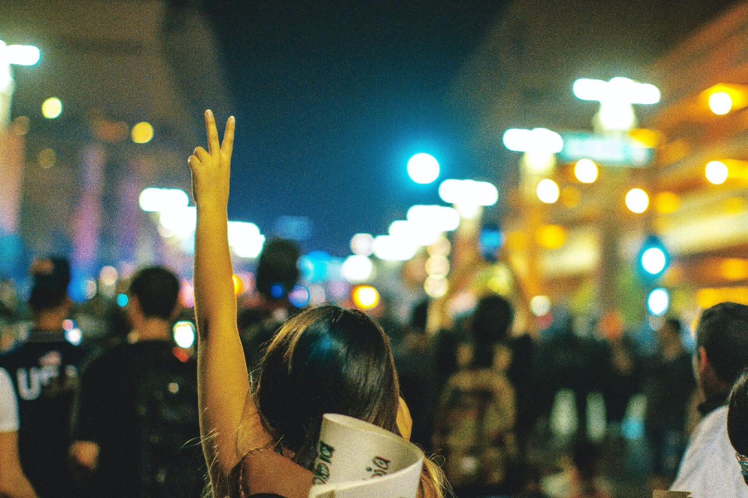 Protesters march at night