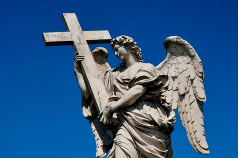 Statue of an angel holding the cross