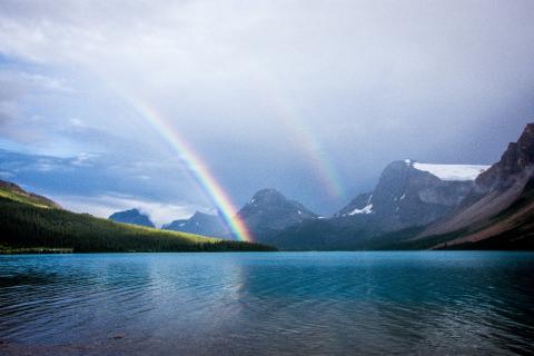 A double rainbow over a lake