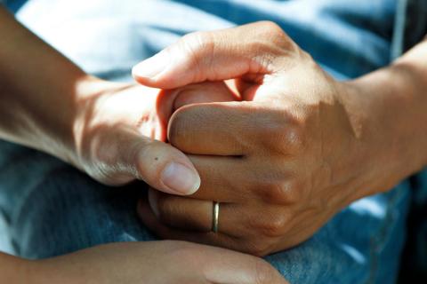 Holding a Patient's Hand