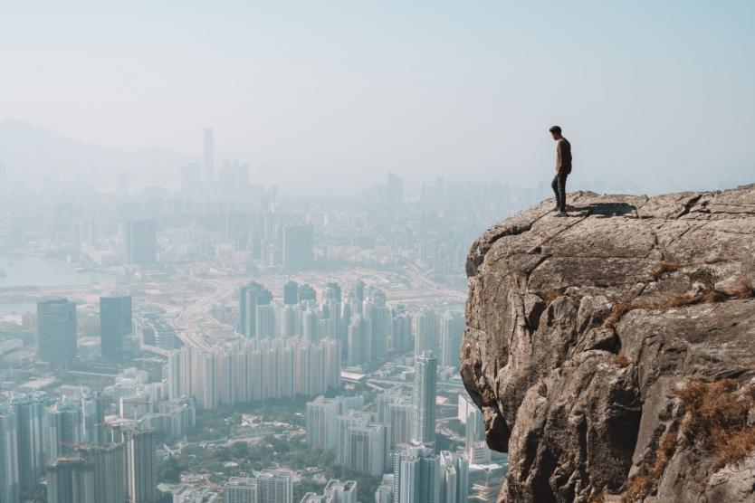 A Man Looking at an Urban Horizon